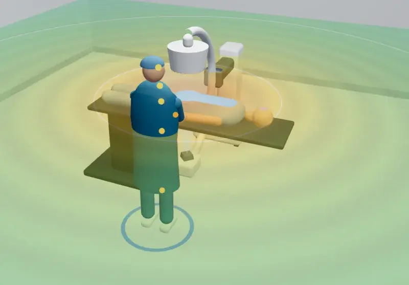 The UpThera Radiation Exposure Simulator: a 3D fluoroscopy room with a mobile C-arm, a patient on the table and an operator in a lead apron, with the scattered radiation field shown in colour around the patient.
